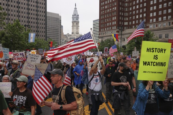 Demonstrators march during the