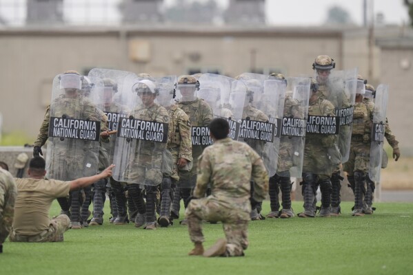 Members of the California National Guard conduct exercises after being deployed to the Los Angeles protests Wednesday, June 11, 2025, in Los Alamitos, Calif. (AP Photo/Jae C. Hong)
