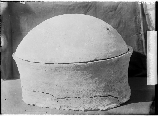 This photo provided by researchers shows a pottery vessel in which the remains of a man, radiocarbon dated to around 2855–2570 cal BCE, was discovered in Nuwayrat, Egypt. (John Garstang, Mahmoud Abd El Gelel/Garstang Museum of Archaeology/University of Liverpool via AP)