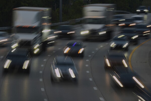 Vehicles drive along a highway July 30, 2025, in Cincinnati. (AP Photo/Joshua A. Bickel, File)