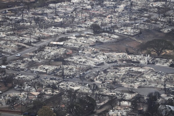 Wildfire wreckage is seen on Aug. 10, 2023, in Lahaina, Hawaii. (AP Photo/Rick Bowmer, File)