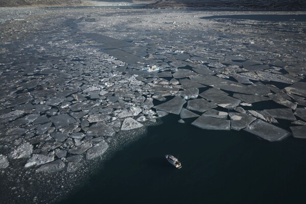 Pieces of ice move through the sea in Qoornoq Island, near Nuuk, Greenland on Feb. 17, 2025. (AP Photo/Emilio Morenatti, File)