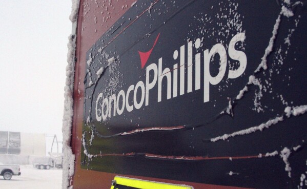An ice-covered ConocoPhillips sign is displayed at the Colville-Delta 5, more commonly known as CD5, drilling site on Alaska's North Slope, Feb. 9, 2016. (AP Photo/Mark Thiessen, File)